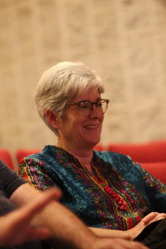 a woman smiling in a room