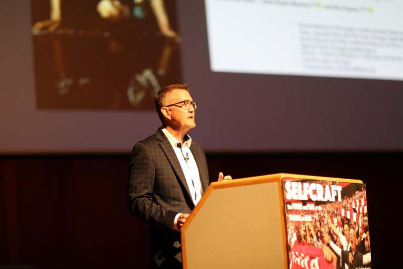 a man standing at a podium