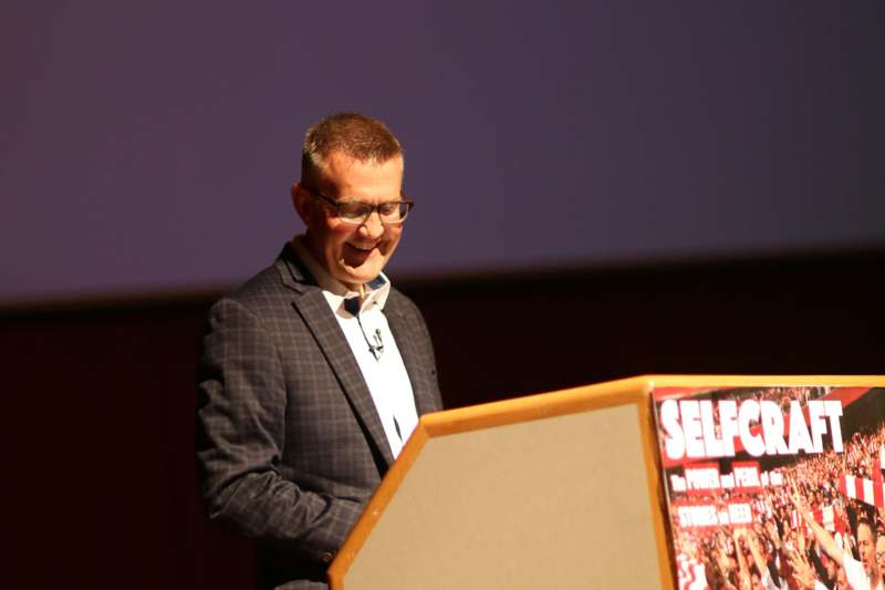 a man standing at a podium