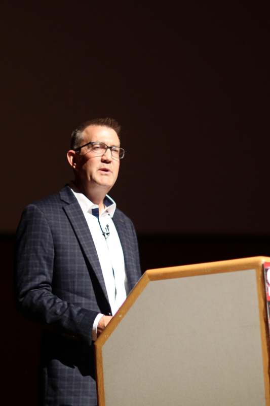 a man standing at a podium