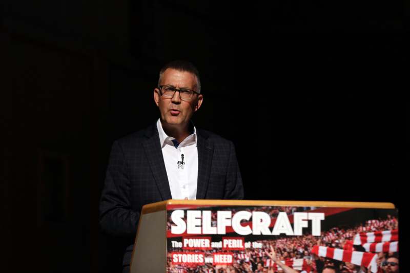a man standing at a podium