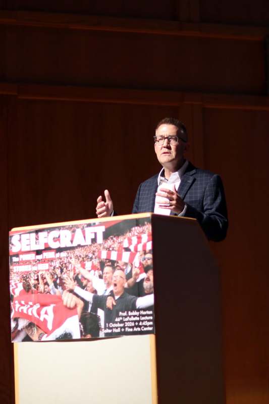 a man standing at a podium