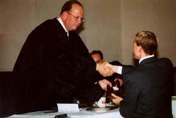 a judge shaking hands with another judge