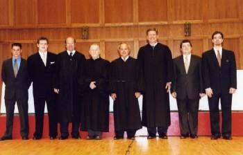 a group of men in black robes