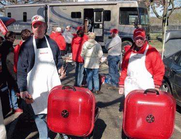 a group of people with red luggage