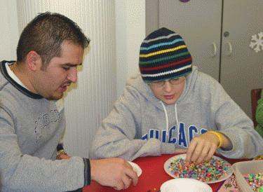 a man and boy eating sprinkles