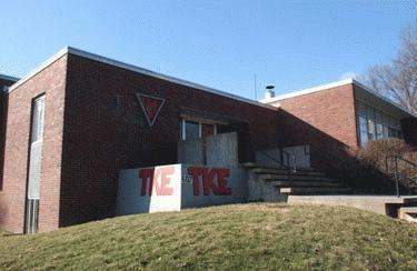 a brick building with a concrete wall