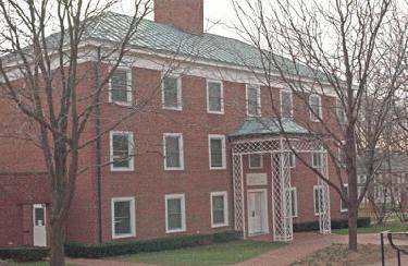 a brick building with a white door