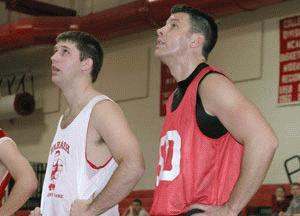 a couple of men in basketball uniforms